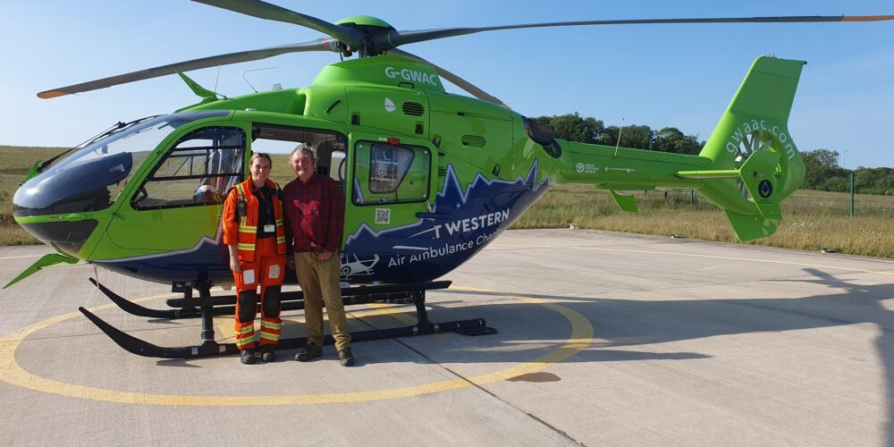 Mark Horton and Doctor Celestine by the GWAAC helicopter