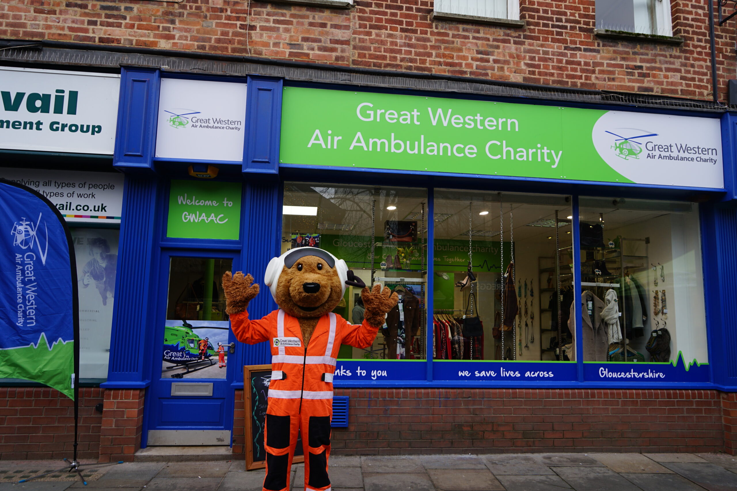 Charlie Bear mascot outside of Gloucester Boutique shop