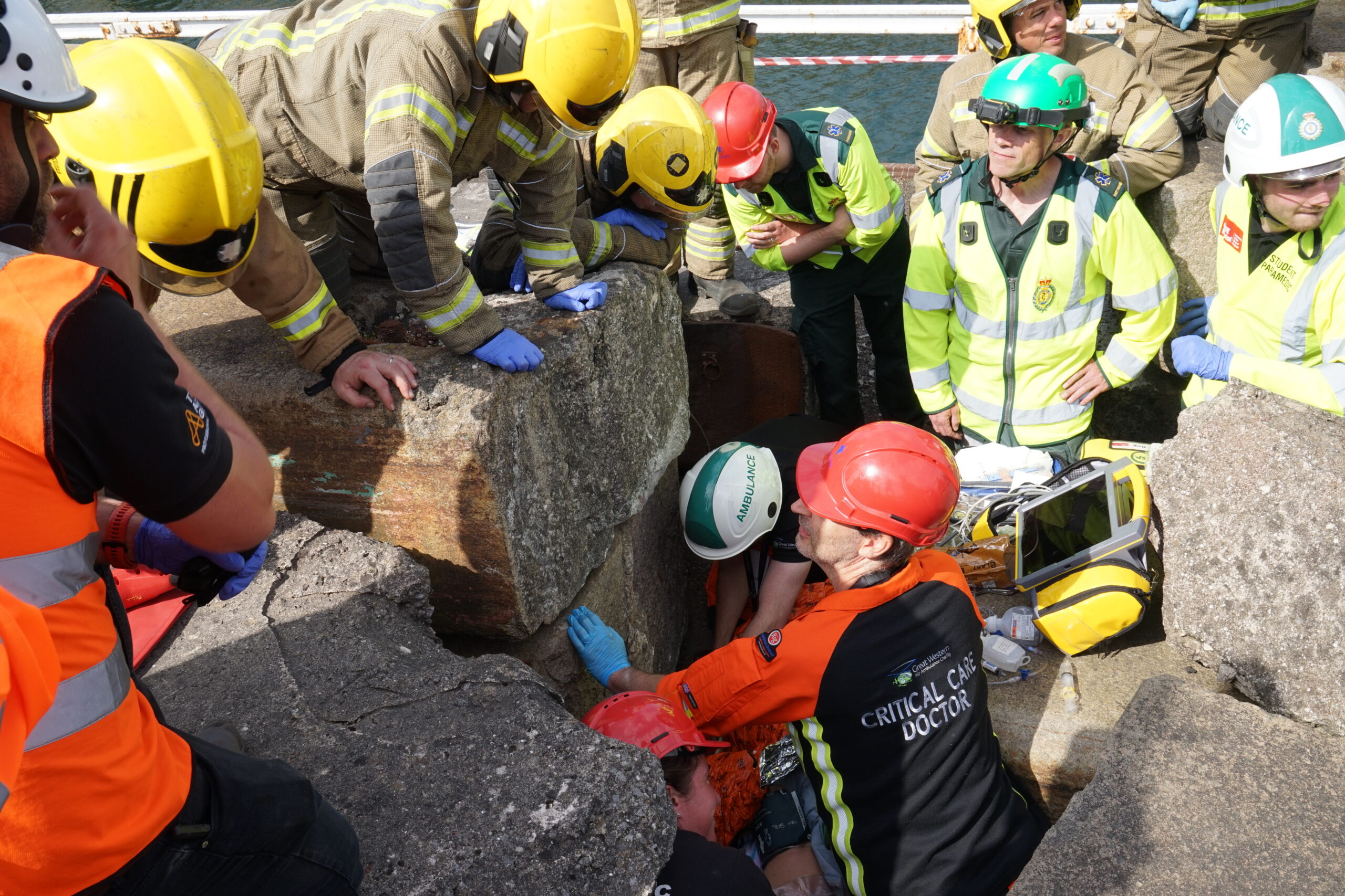 A patient is attended to after being crushed by concrete blocks.