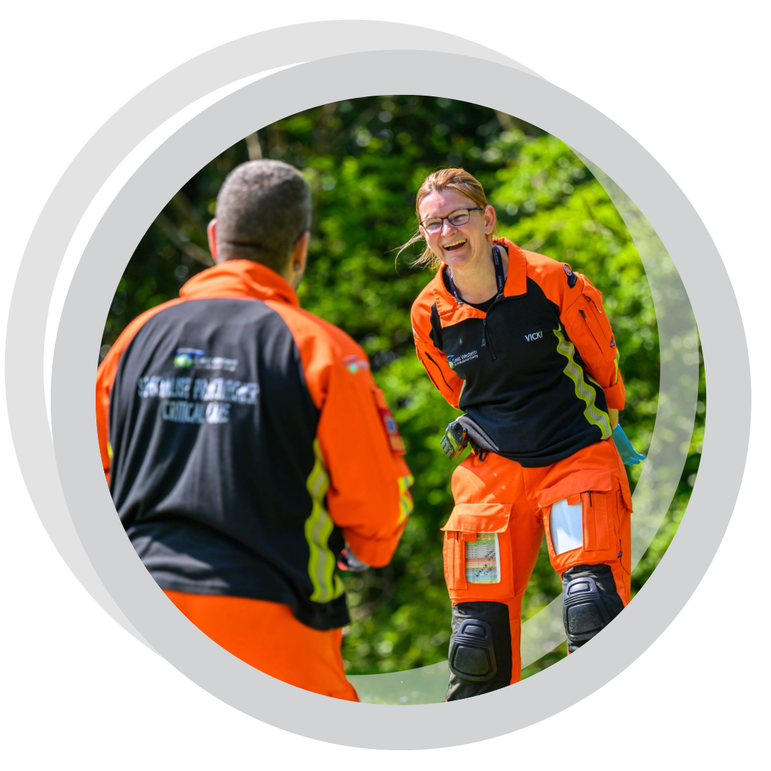 Two paramedics laughing