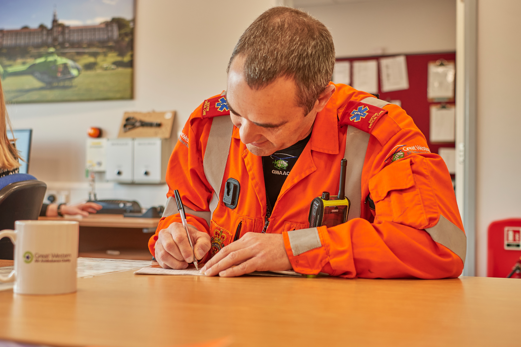 Critical Care Doctor Rich writing in the GWAAC Ops Room