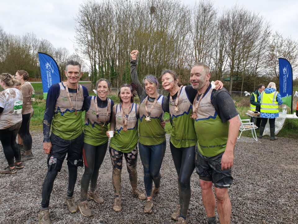 GWAAC Mud Master participants after the race, caked in mud.