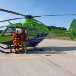 Mark Horton and Doctor Celestine by the GWAAC helicopter