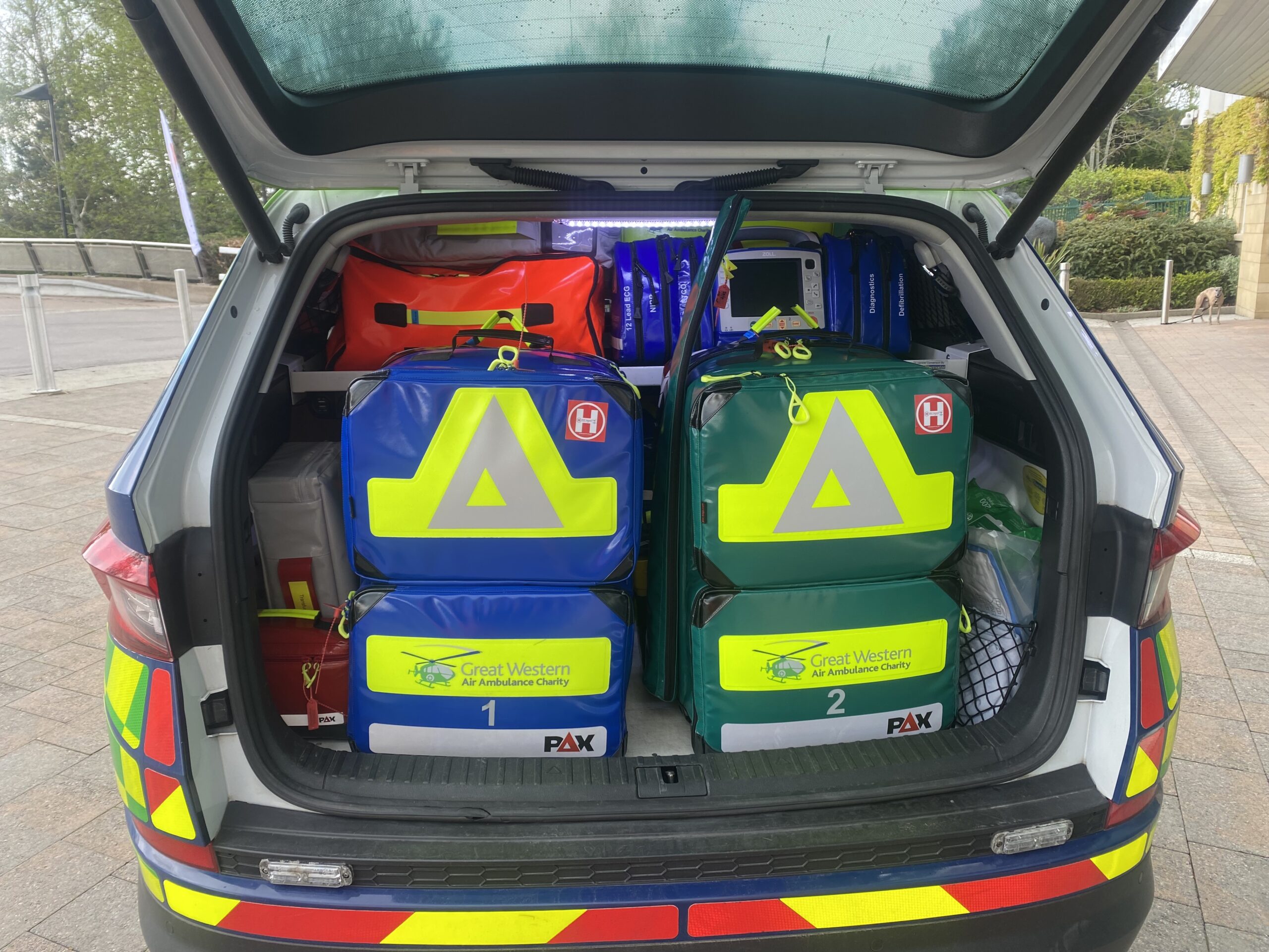 Kit bags and other equipment in the back of a  critical care car