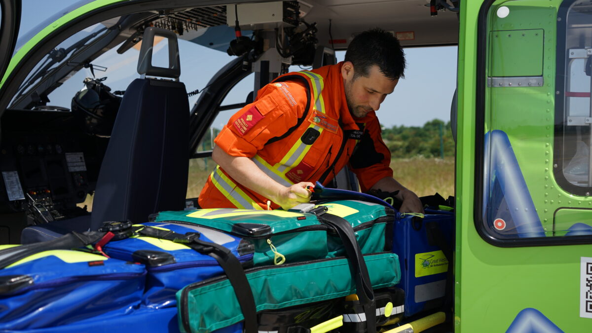 SPCC Jack loading new kit bags into the heli