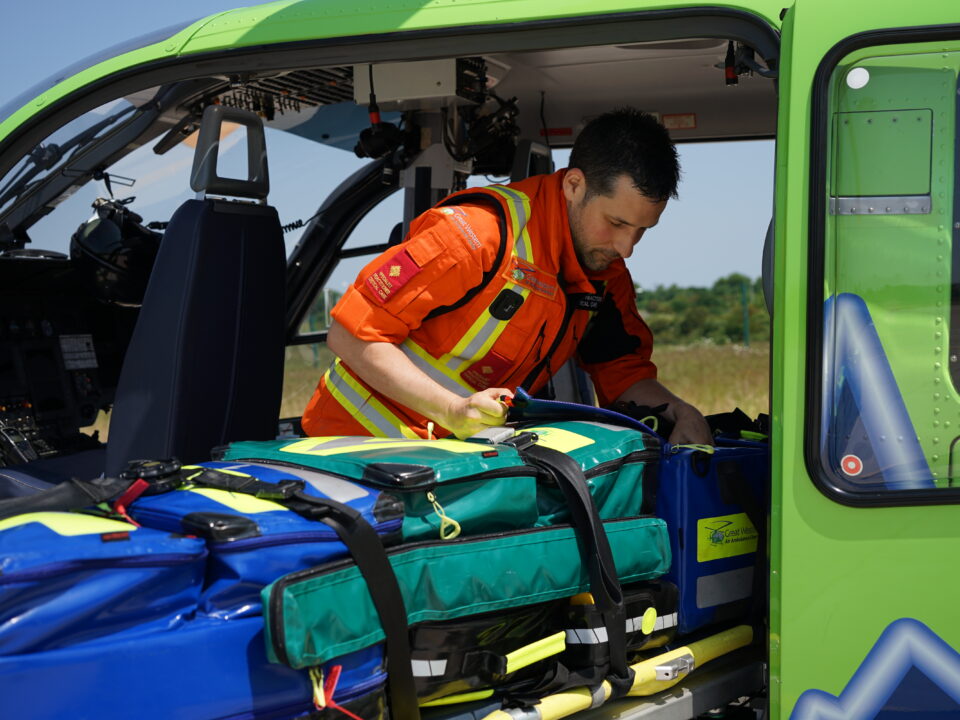 SPCC Jack loading new kit bags into the heli