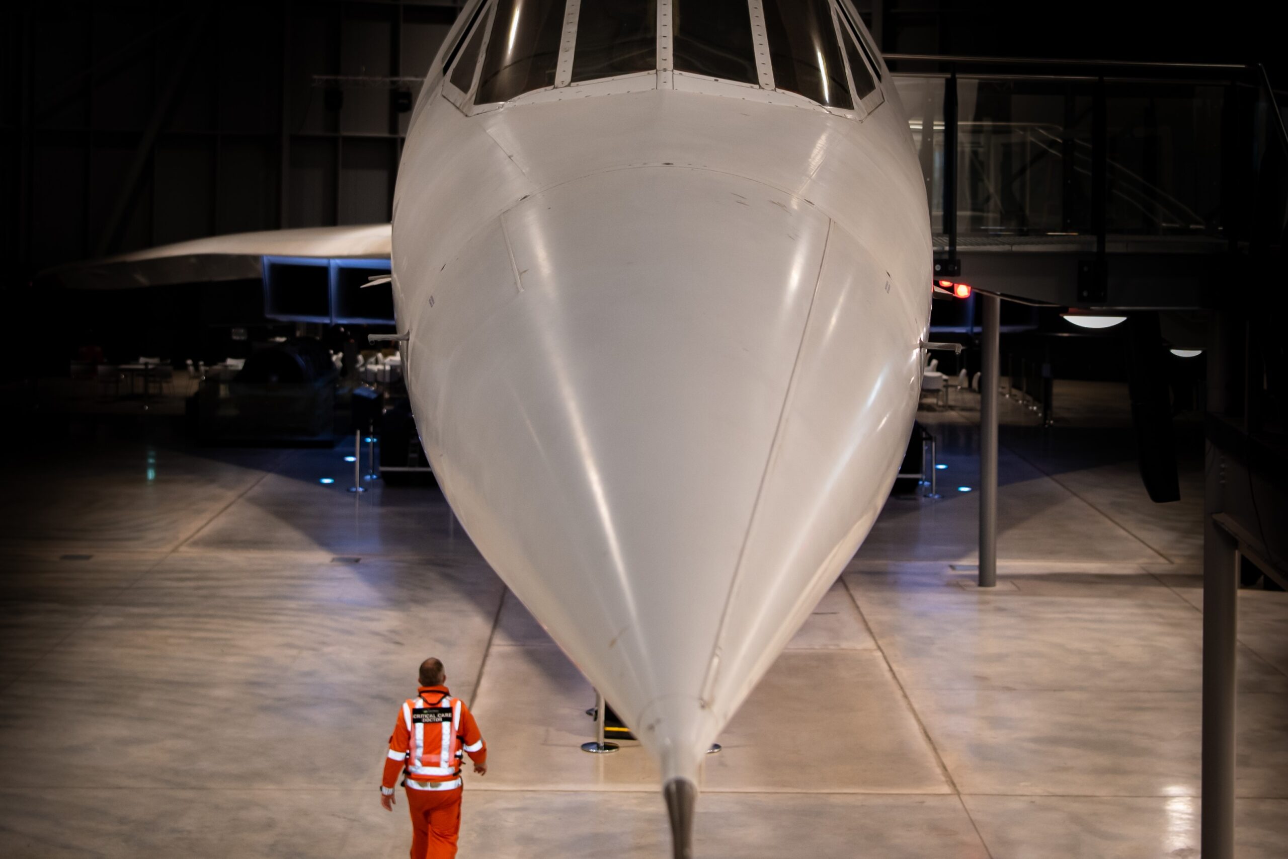 A member of the GWAAC crew under the concorde at Aerospace Bristol