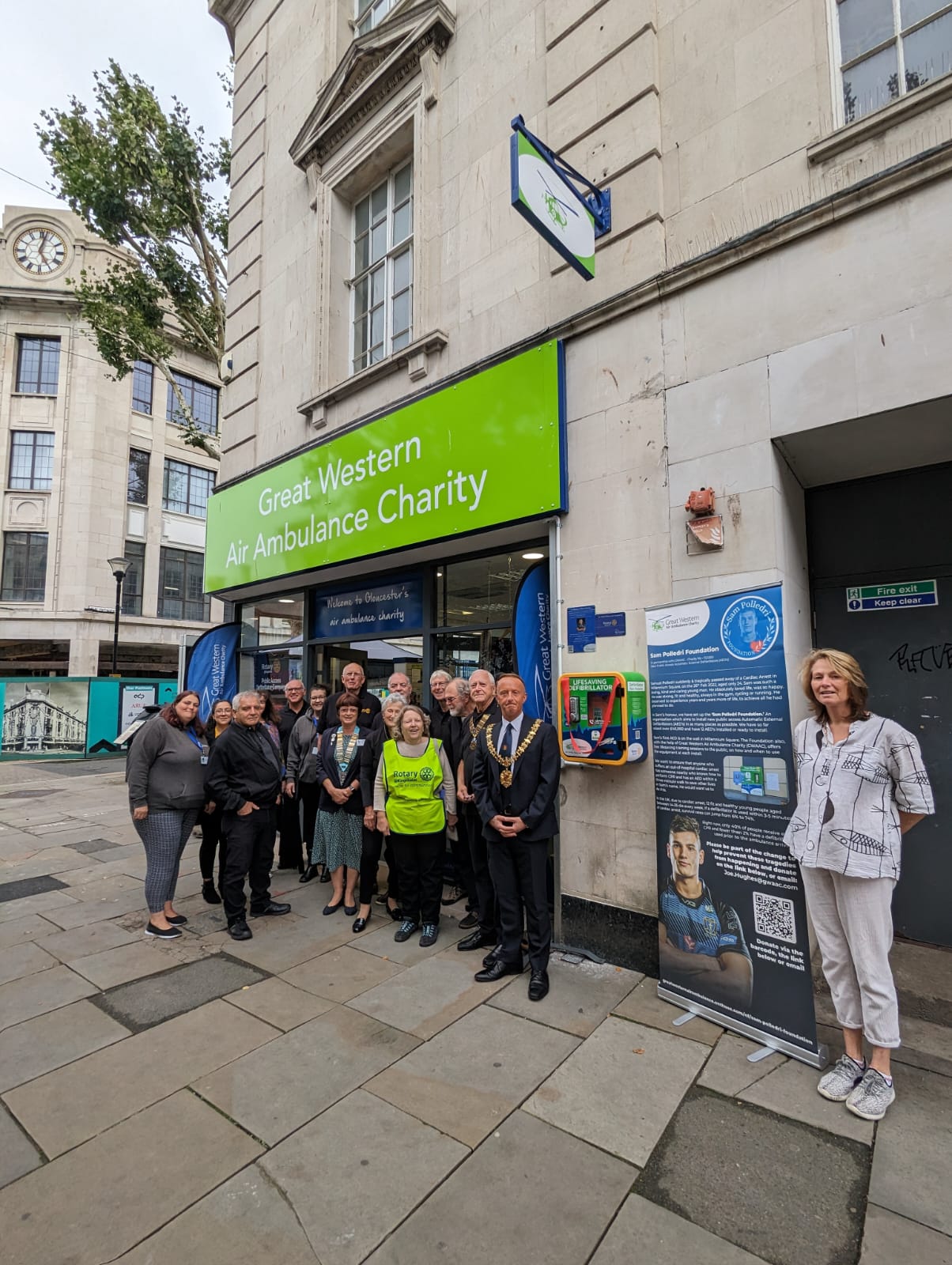 A crew from GWAAC, the Polledri Foundation Great Western Heartstarters and Gloucester dignitaries at the unveliling of a defibrillator outside the GWAAC charity shop in Gloucester city centre