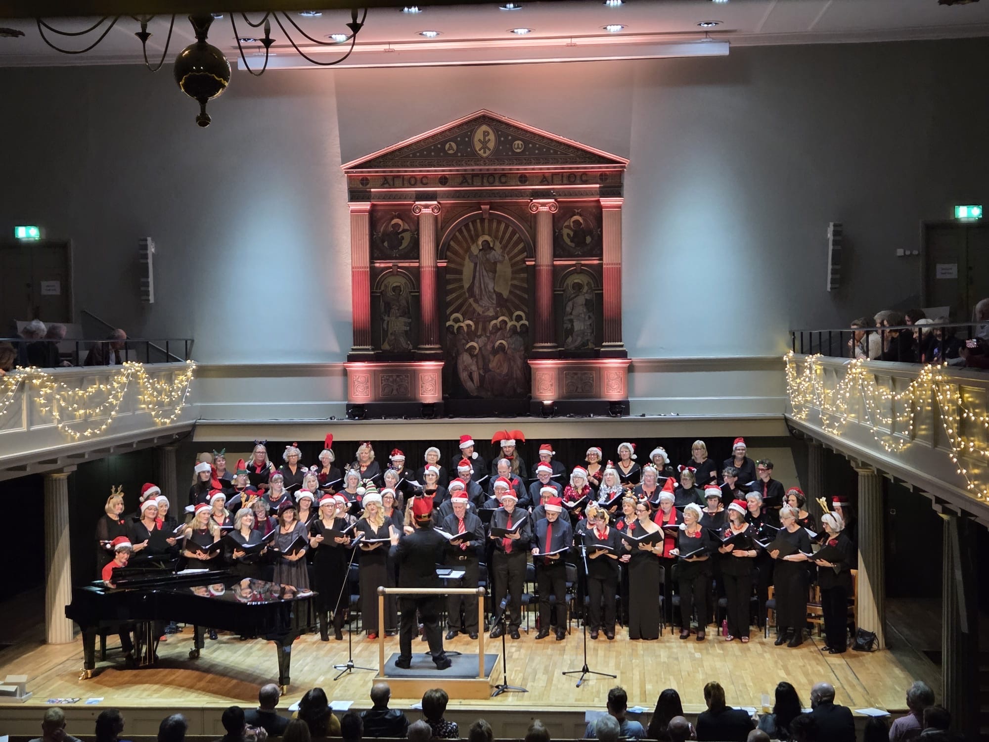 The City Voices Bristol choir perform on stage for their Christmas concert
