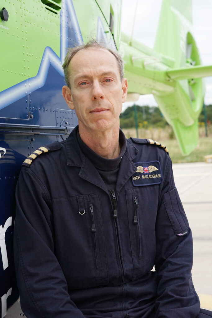 Pilot Rich MacLaughlin sat by the GWAAC helicopter