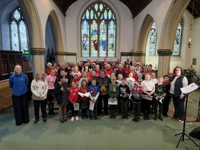 Members of Good Afternoon Choir Yate and Chipping Sodbury pictured in a church