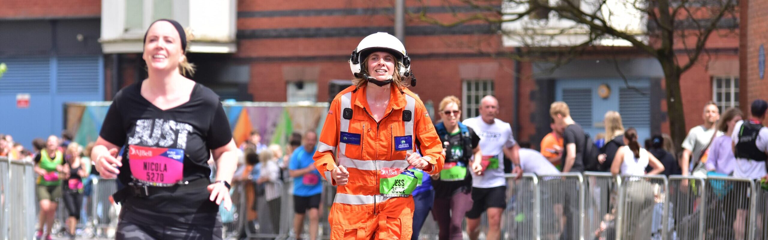 Runner Jess taking on the Great Bristol Run in GWAAC flightsuit and helmet