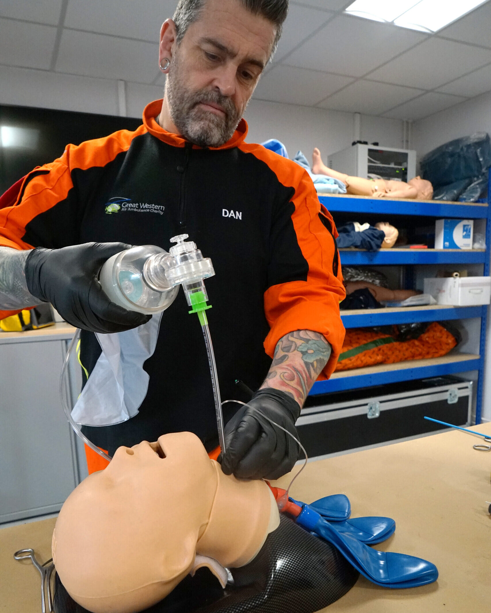 SPCC Dan Davis performing a surgical airways simnulation on a training mannekin