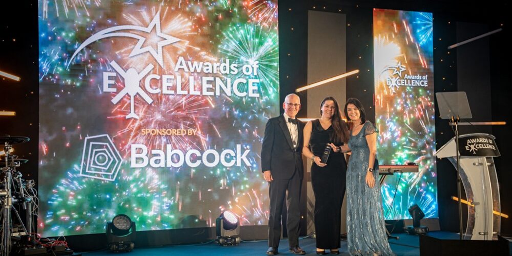 GWAAC CEO Anna Perry (middle) collecting Supplier of the Year award for FLT Group's outstanding support