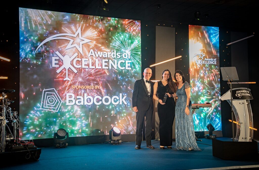 GWAAC CEO Anna Perry (middle) collecting Supplier of the Year award for FLT Group's outstanding support