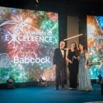 GWAAC CEO Anna Perry (middle) collecting Supplier of the Year award for FLT Group's outstanding support