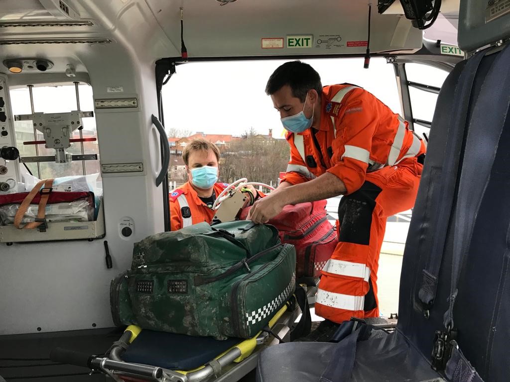 crew loading helicopter with kit