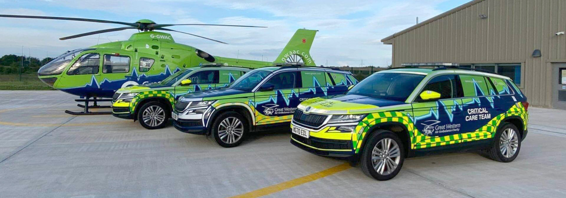 The GWAAC critical care cars next to the helicopter