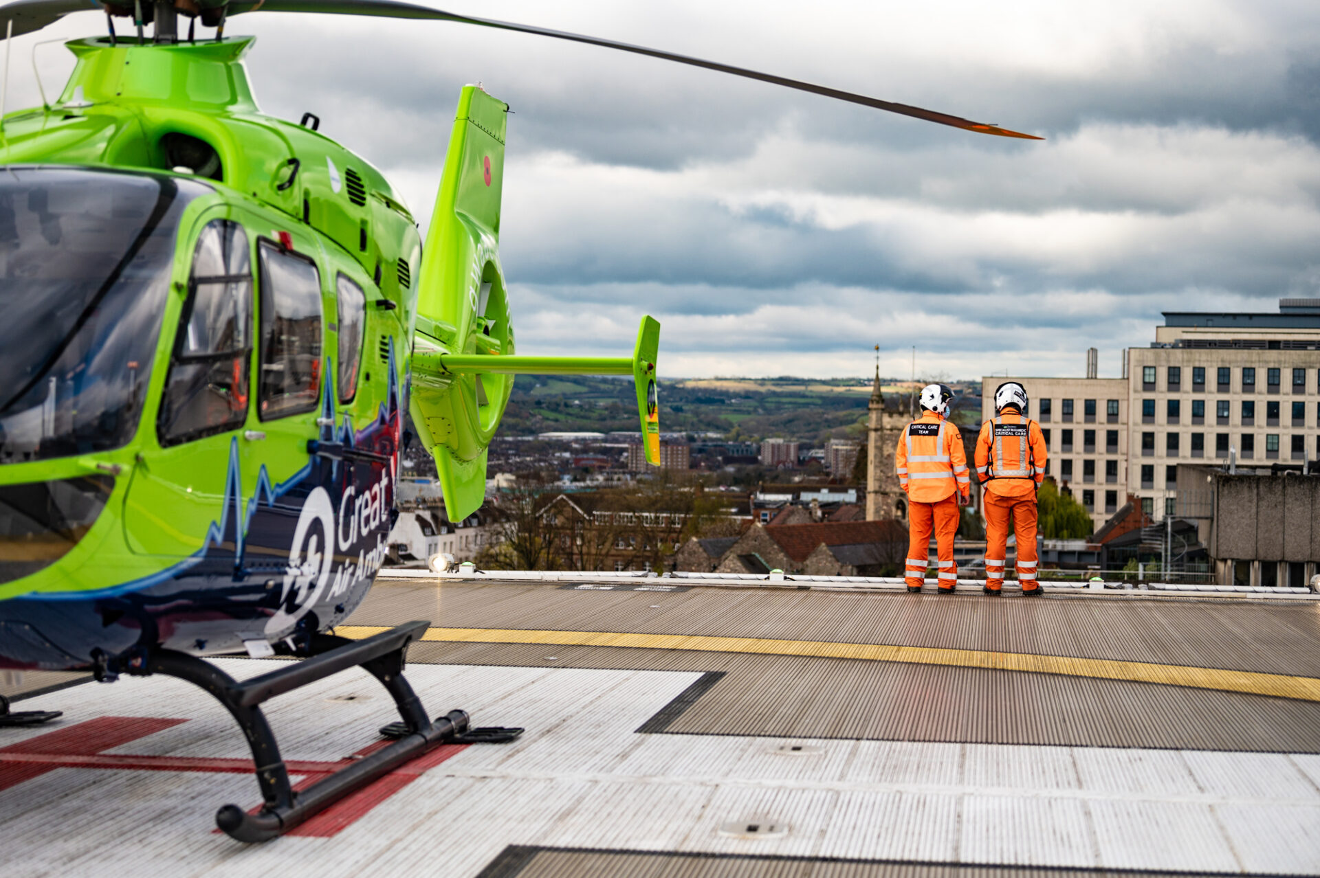 A Critical Care Doctor and SPCC next to the GWAAC helicopter on top of the BRI