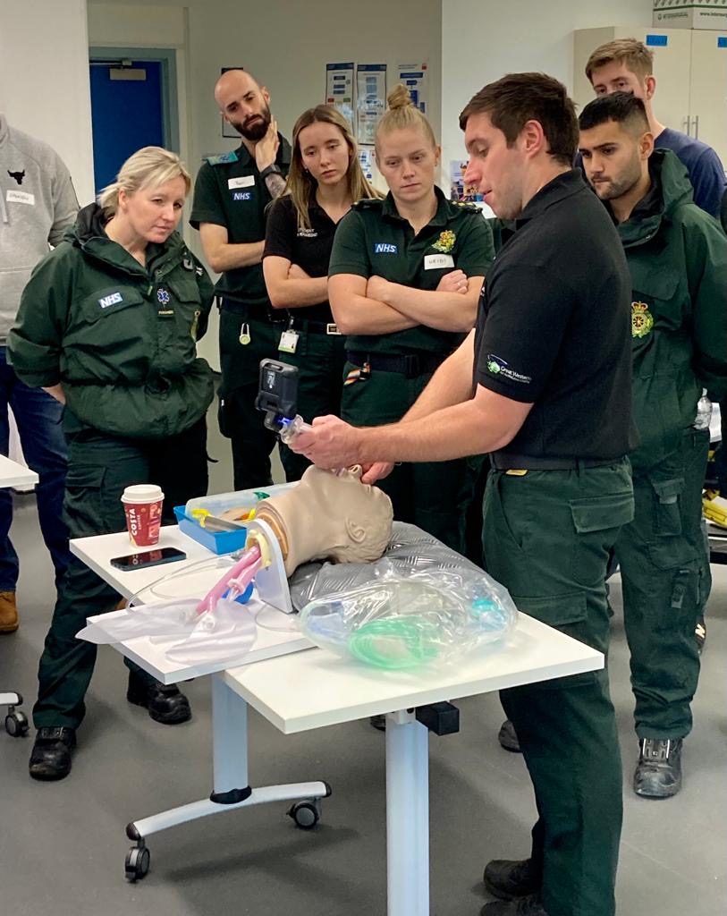 SPCC Callum Sutton demonstrating the digital laryngascope to some SWAST paramedics