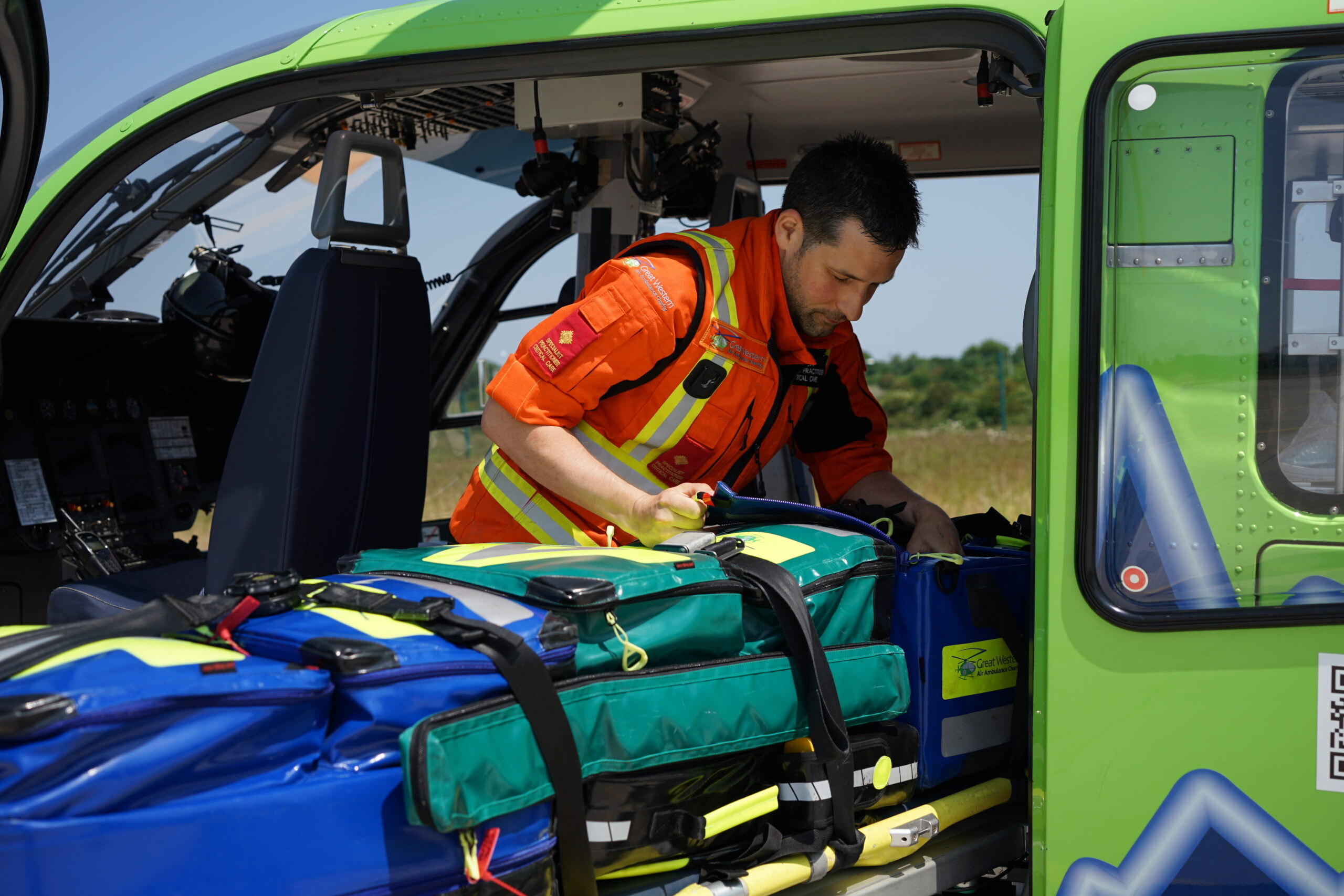 SPCC Jack loading new kit bags into the heli